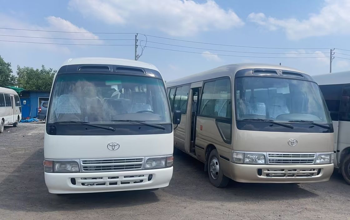 7м 30 мест Toyo Ta Coaster Автобусный двигатель вместимостью 4L Общие размеры мм 7725x2000x2600